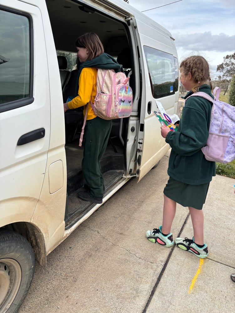 Students getting on the school bus